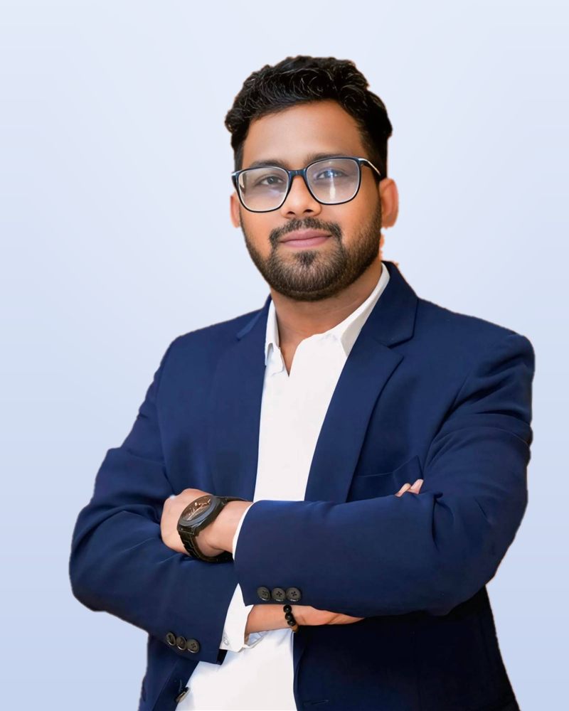 Nitin Kumar, a School Decide student, in a navy blazer with his arms crossed